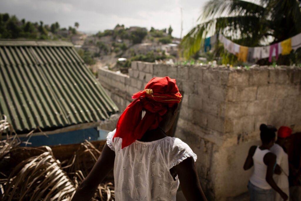 Haiti outside brick wall.